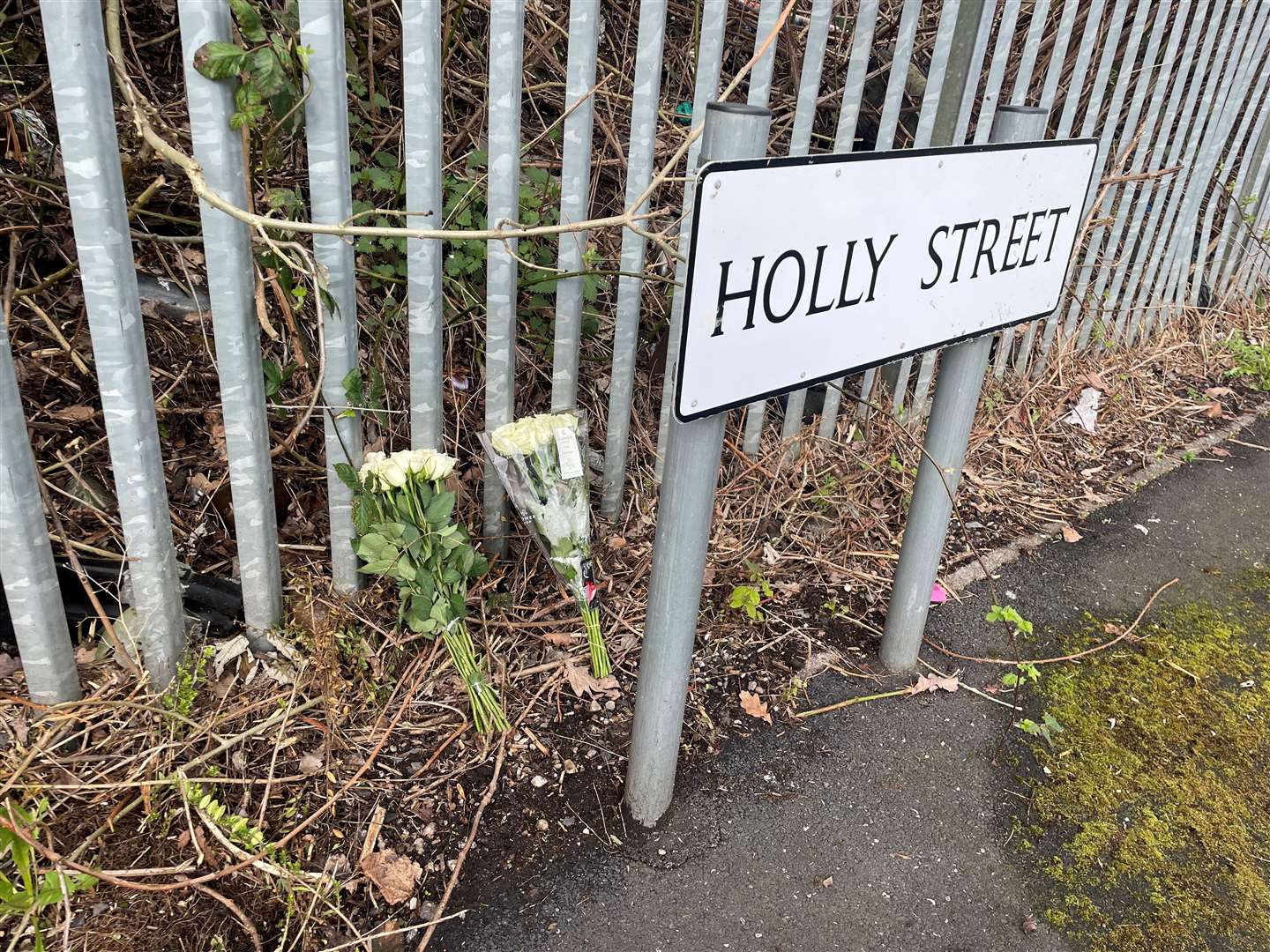 Flowers at the scene in Beswick (Pat Hurst/PA)