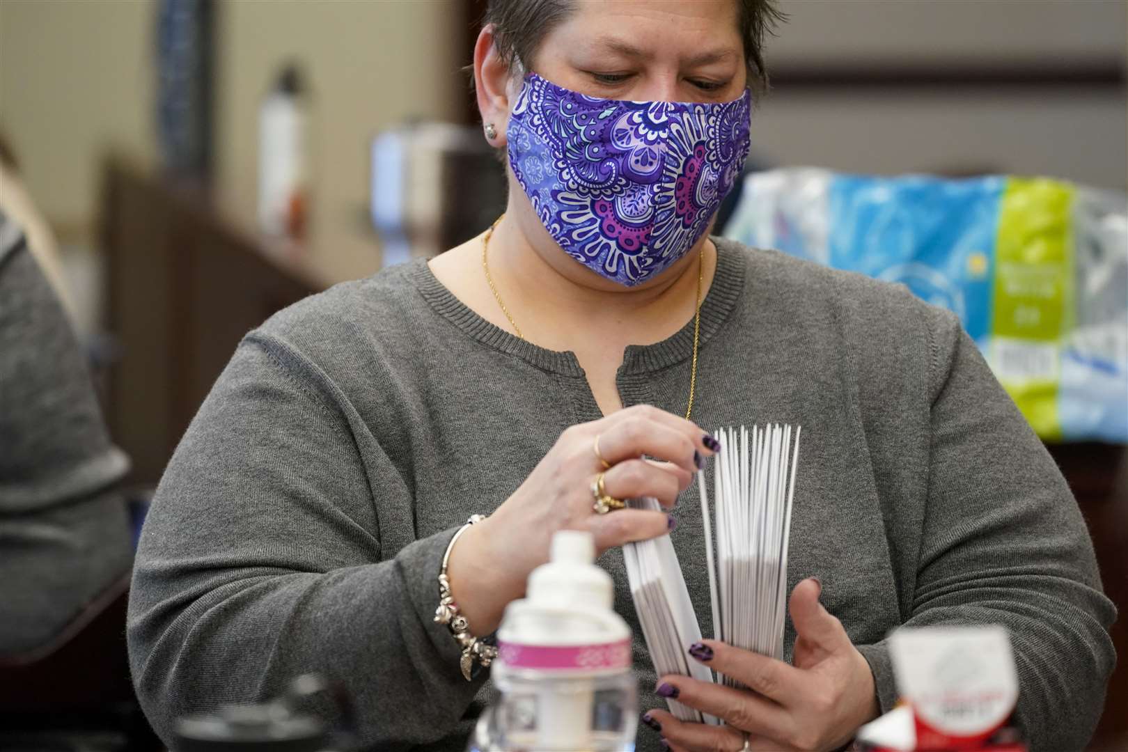 Municipal workers extract ballots from their envelopes (AP)