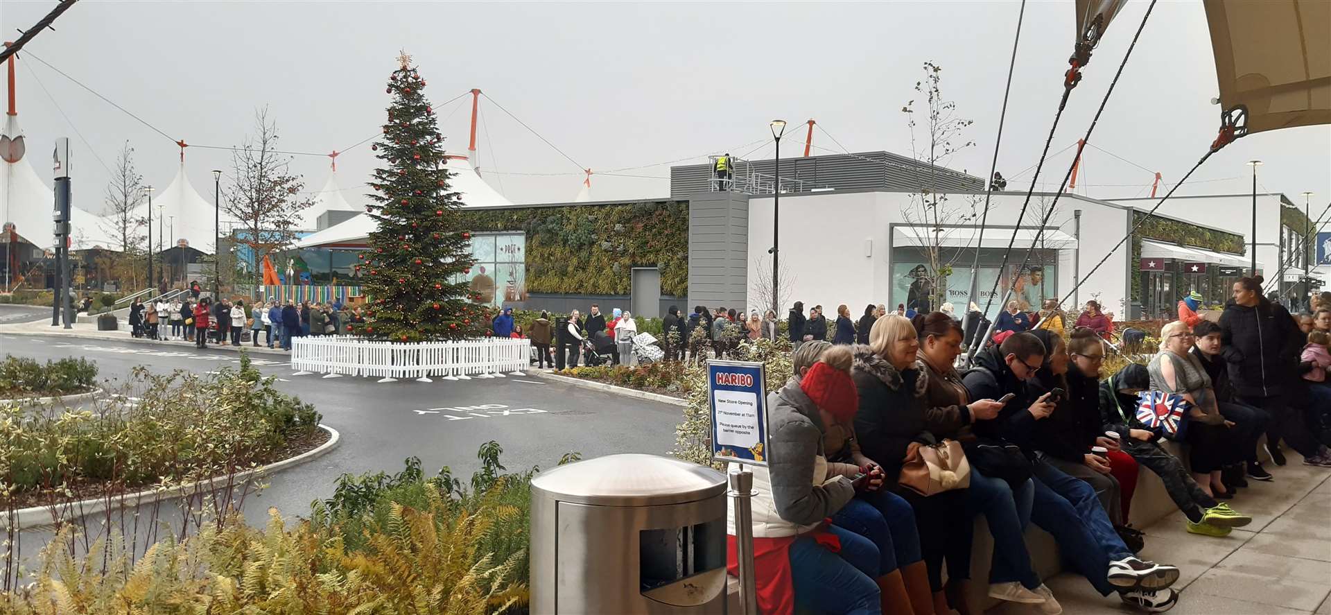 Huge queues have formed ahead of the 11am opening of the new Haribo store in the Ashford Designer Outlet