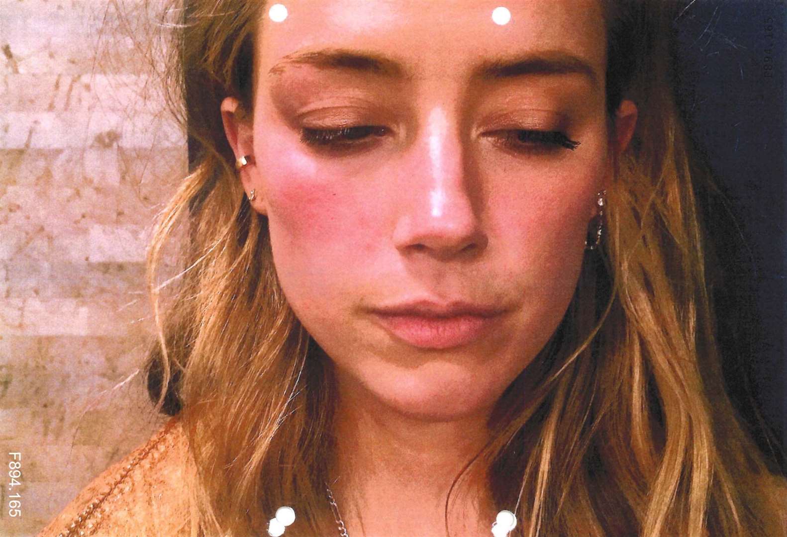 A photo shown in court from May 2016 of Amber Heard which has been referred to as an exhibit in the hearing (Handout/PA)