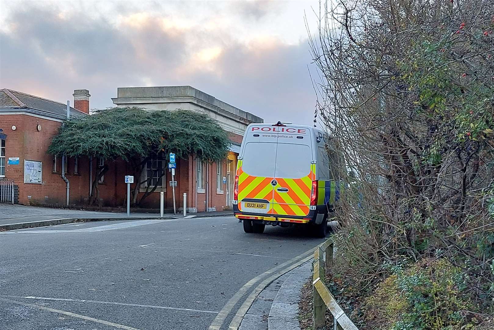 Police outside Whitstable train station after Modasher Hossain was stabbed