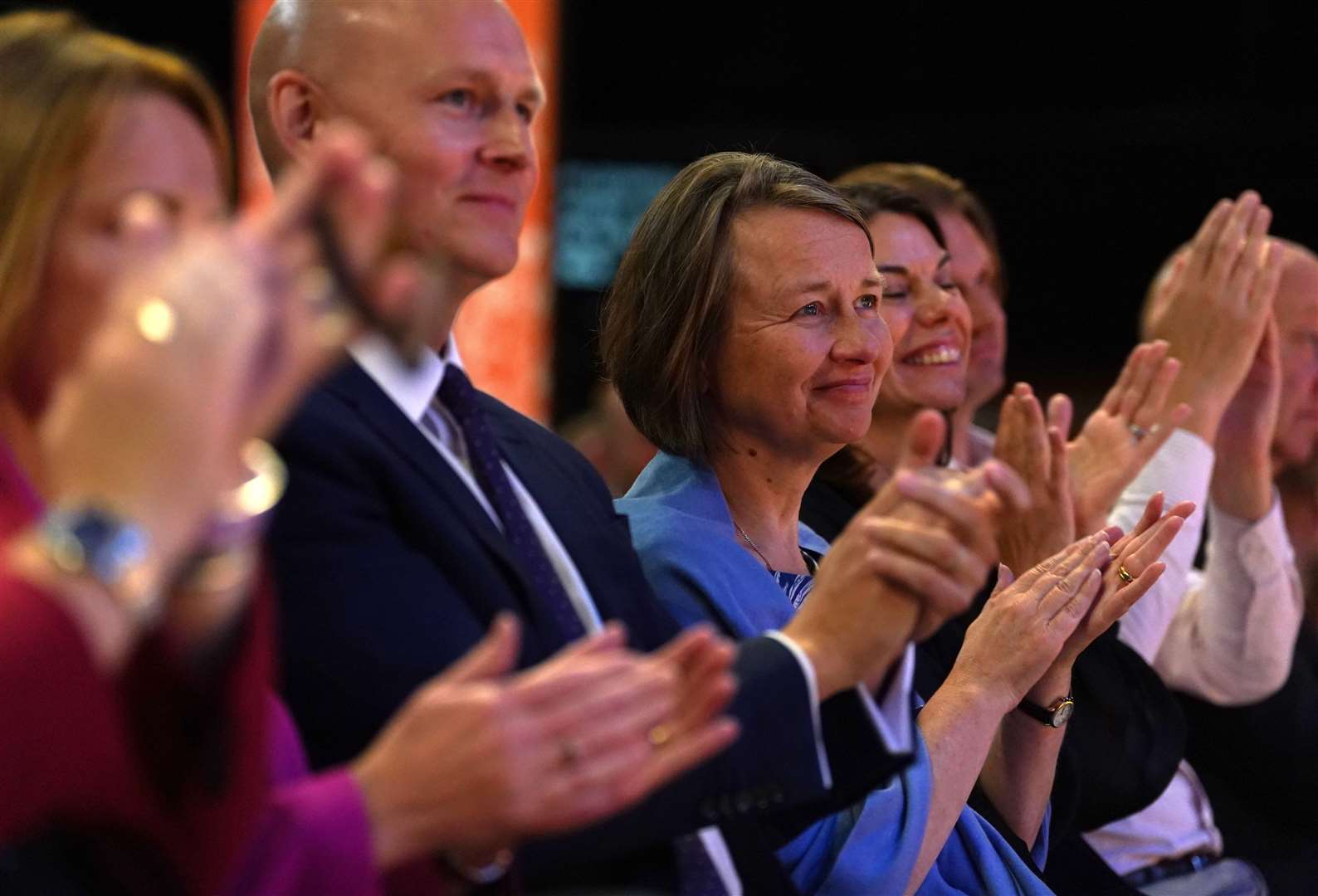 Sir Ed Davey’s wife Emily Gasson, centre right, was listening to her husband address delegates (Gareth Fuller/PA)