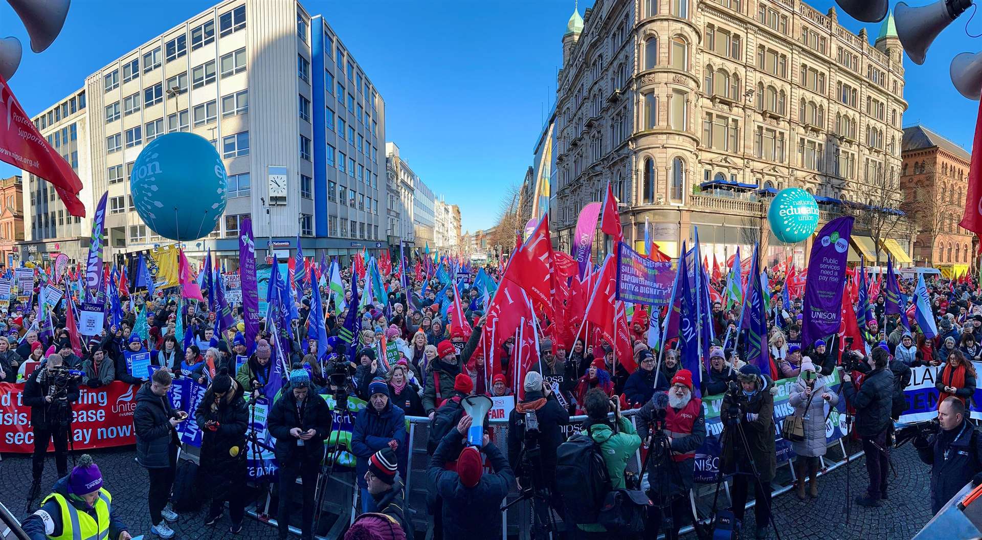 Public sector workers take part in a rally at Belfast City Hall during a huge strike on Thursday (Liam McBurney/PA)