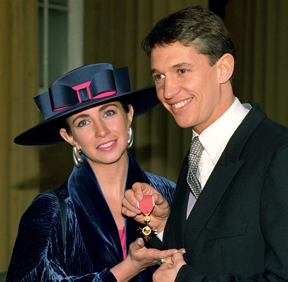 Gary Lineker with his wife Michelle after receiving an OBE from the Queen at Buckingham Palace in 1992 (Fiona Hanson/PA)