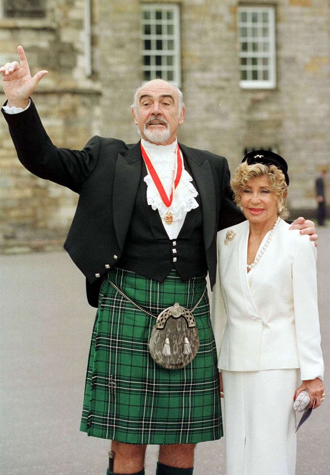 Sir Sean Connery, with wife Micheline, donning full Highland dress (PA)