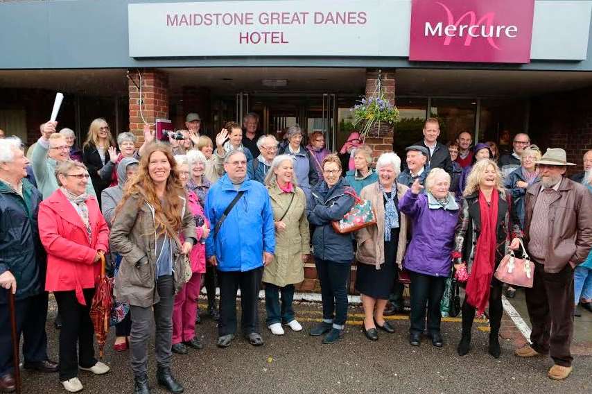 People gather outside the public inquiry into 500 homes