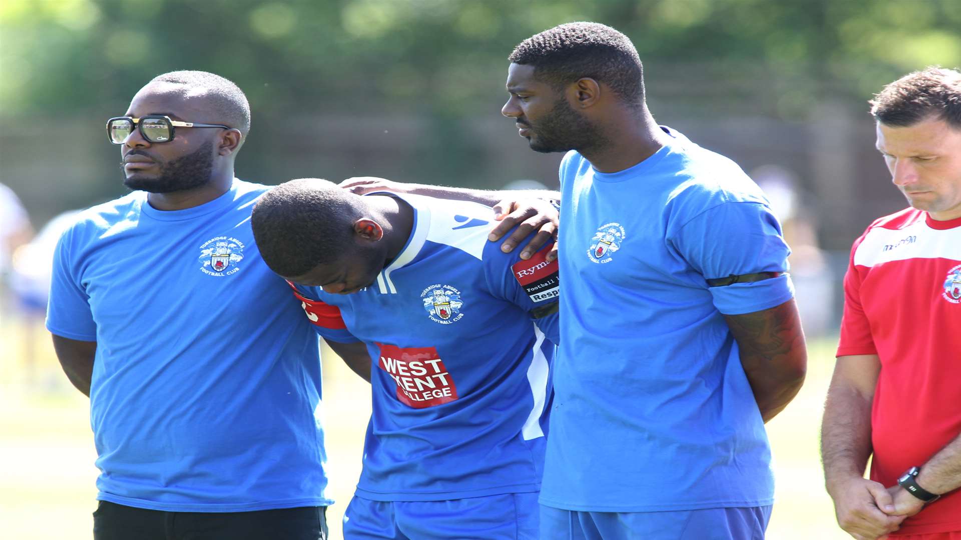 Tonbridge Captain, James Folkes (middle), pays his respects to Junior Dian