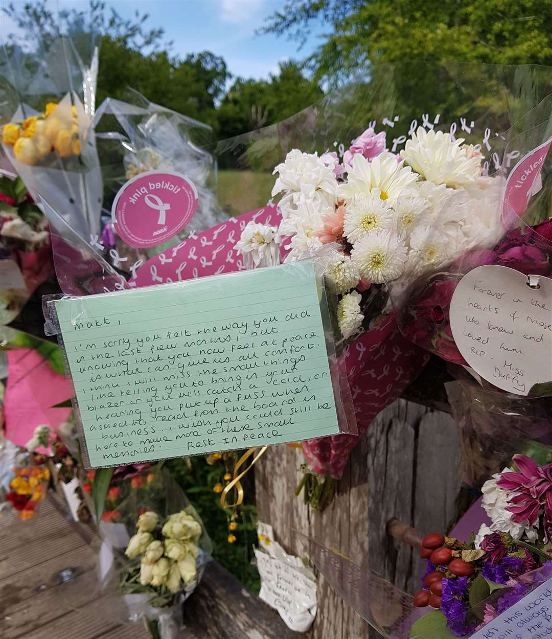 Flowers and messages gathered in Dunorlan Park
