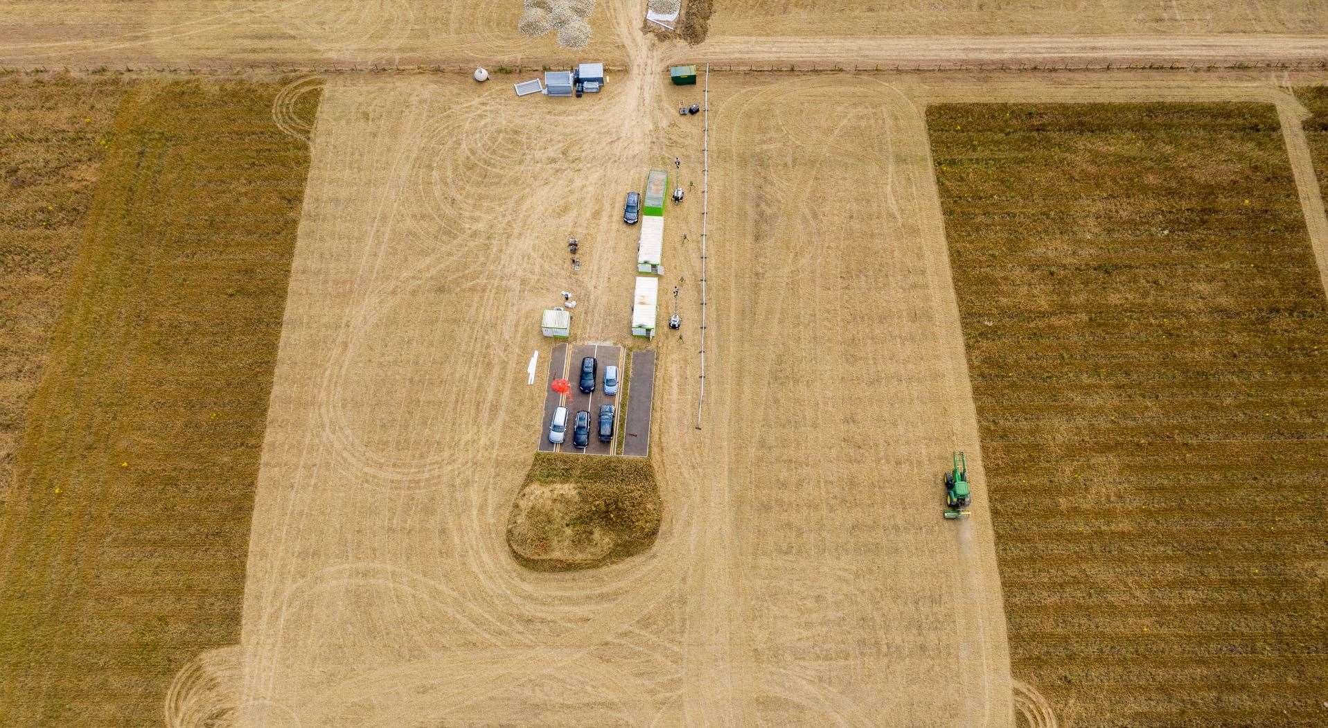 The first workers pictured on the land in July