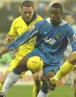 CONFIDENT: Barry Ashby (left) holds up Nathan Ellington the last time the Gills played Wigan