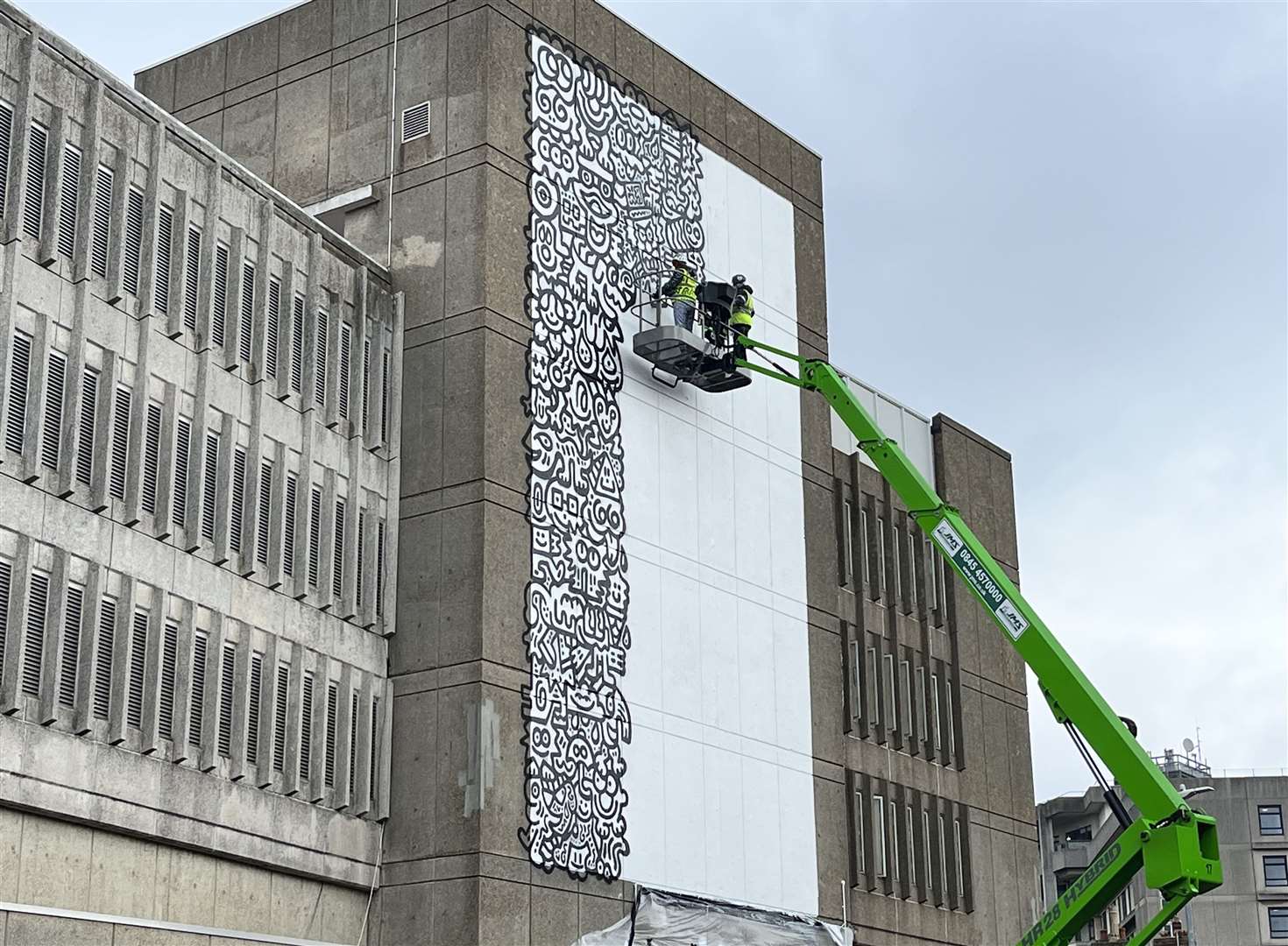 Mr Doodle - who is giving up his time for free - is working on the side of Edinburgh Road car park