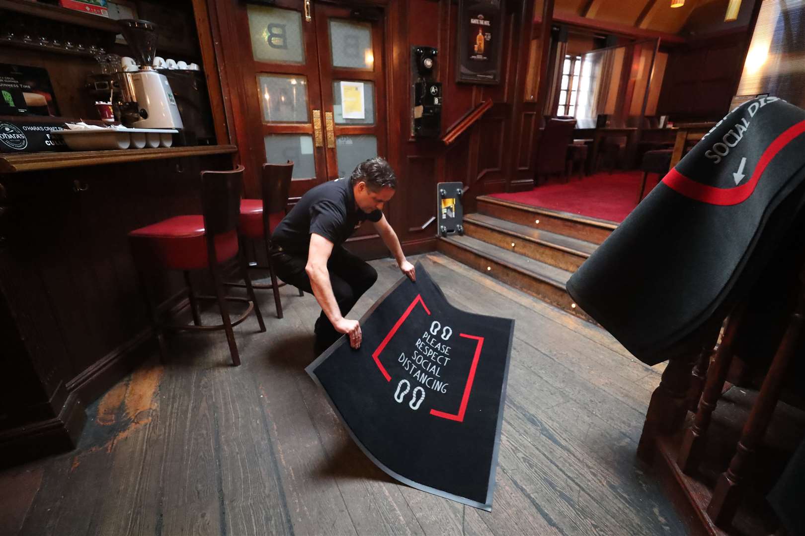 Mariusz Brzyk assistant manager of Paddy Cullen’s pub in Dublin prepares for reopening (Niall Carson/PA)