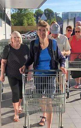 Shoppers entering the store