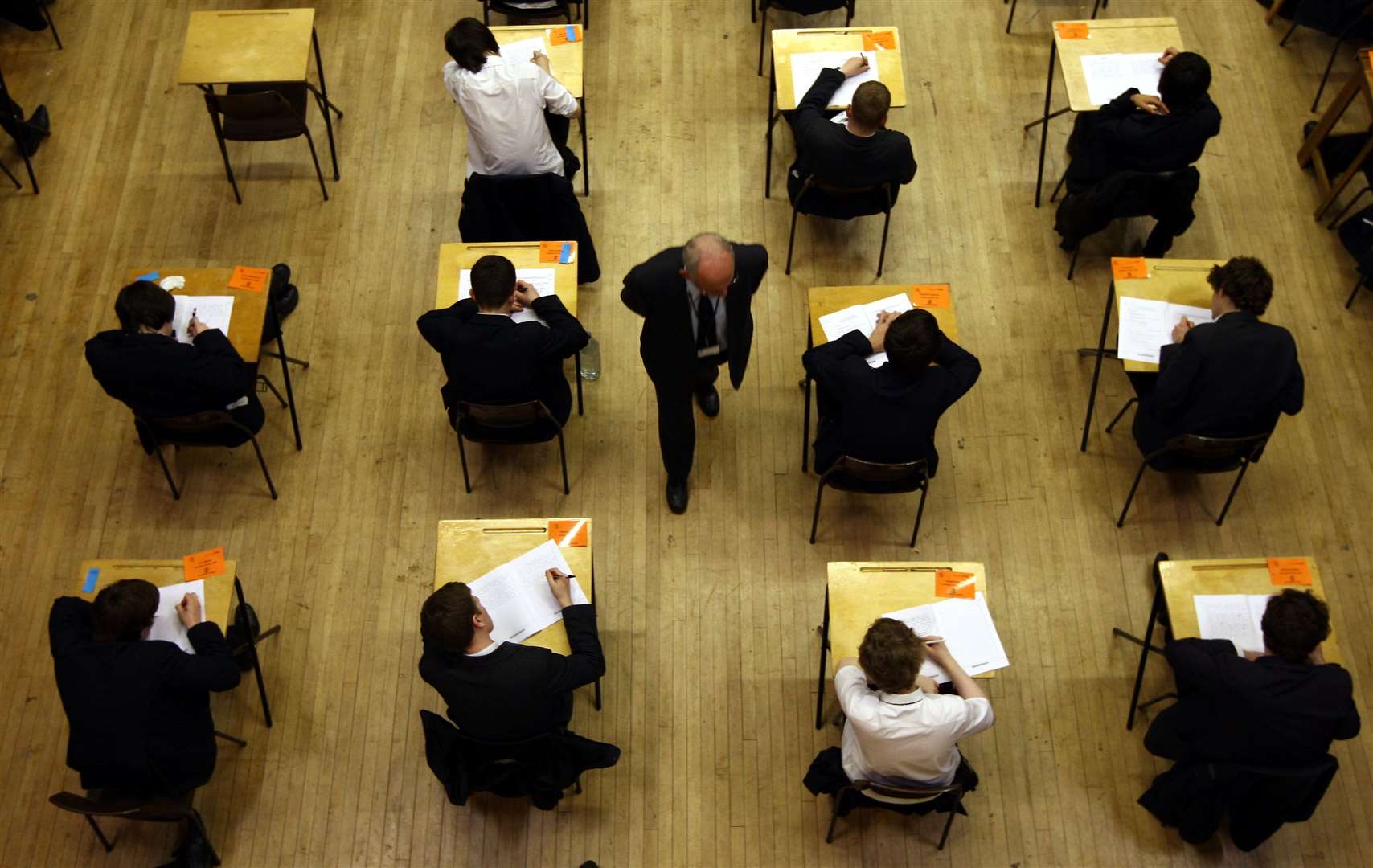 A teacher supervising an exam (David Jones/PA)