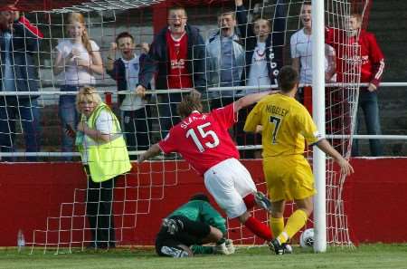 Danny Slatter bundles in Gravesend's third goal against Halifax. Picture: PETER STILL