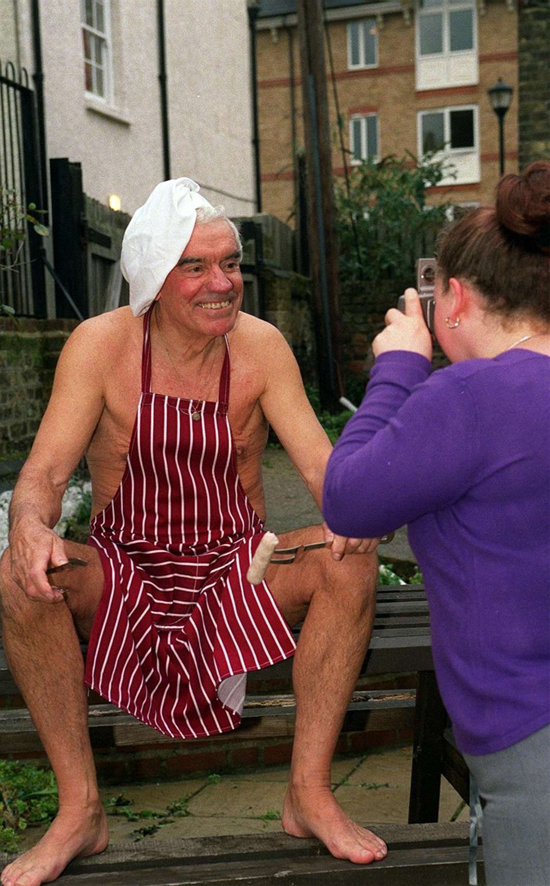 Ken donned just an apron for a charity calender.