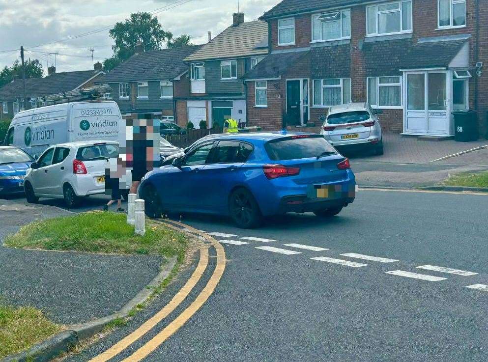 A car parked dangerously on double-yellow lines and over the junction of Highfield Road and Ripley Road