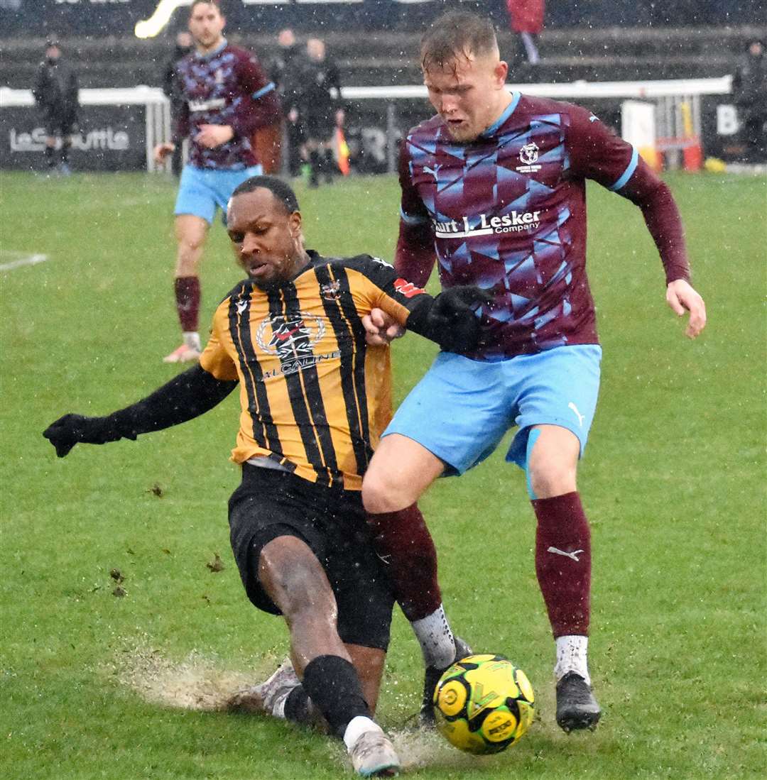 Folkestone's Gavin Hoyte puts a foot in during their 3-1 home Isthmian Premier win over Hastings on New Year’s Day. Picture: Randolph File