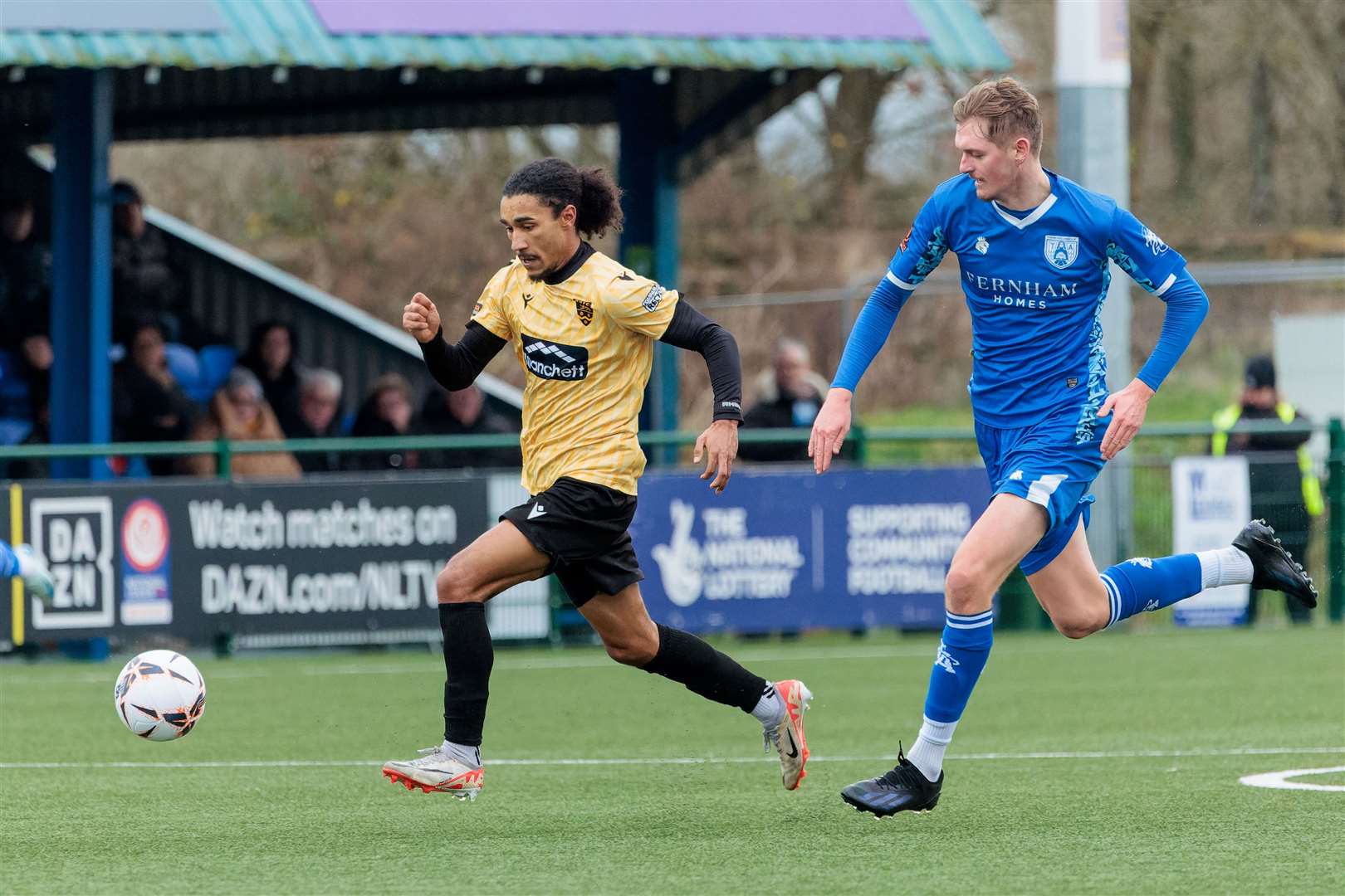 Tonbridge centre-half Ronny Nelson chases down Maidstone forward Aaron Blair. Picture: Helen Cooper