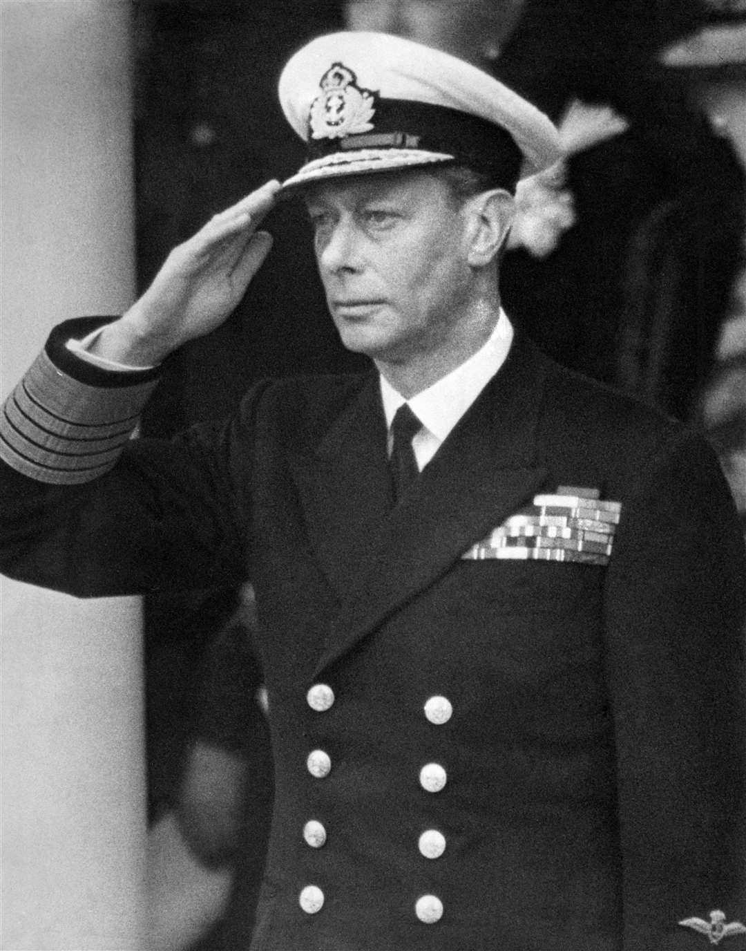 King George VI saluting the fly past of 300 RAF aircraft which took place over the Saluting Base in the Mall at the end of the Victory Parade (PA)