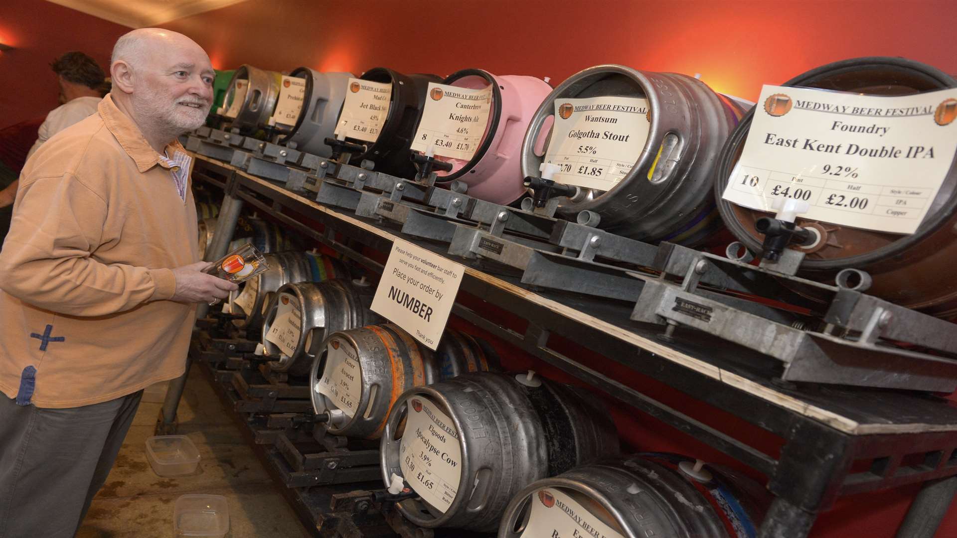 John Brice looks along the line of Kent ales at the Medway Beer Festival 2013