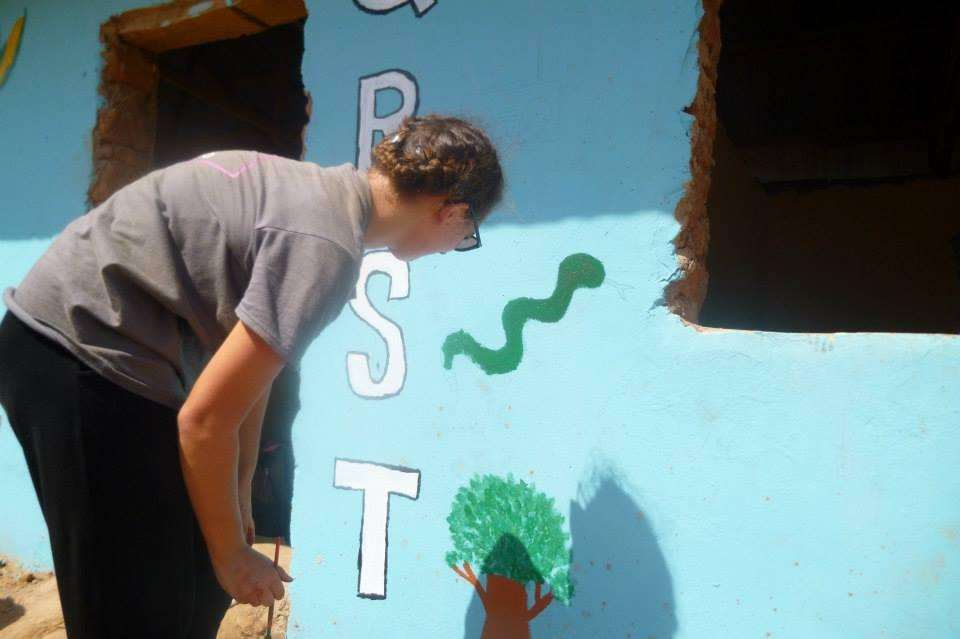 Sian painting the local primary school