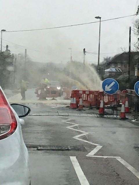 Water is spraying across the road in Princes Avenue, Walderslade. Pic: Kelly Louise Kirby