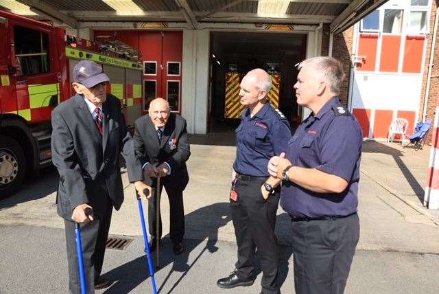 Peter Whent (left) and Don Bates recall the day of the crash with serving fire officers (41819530)