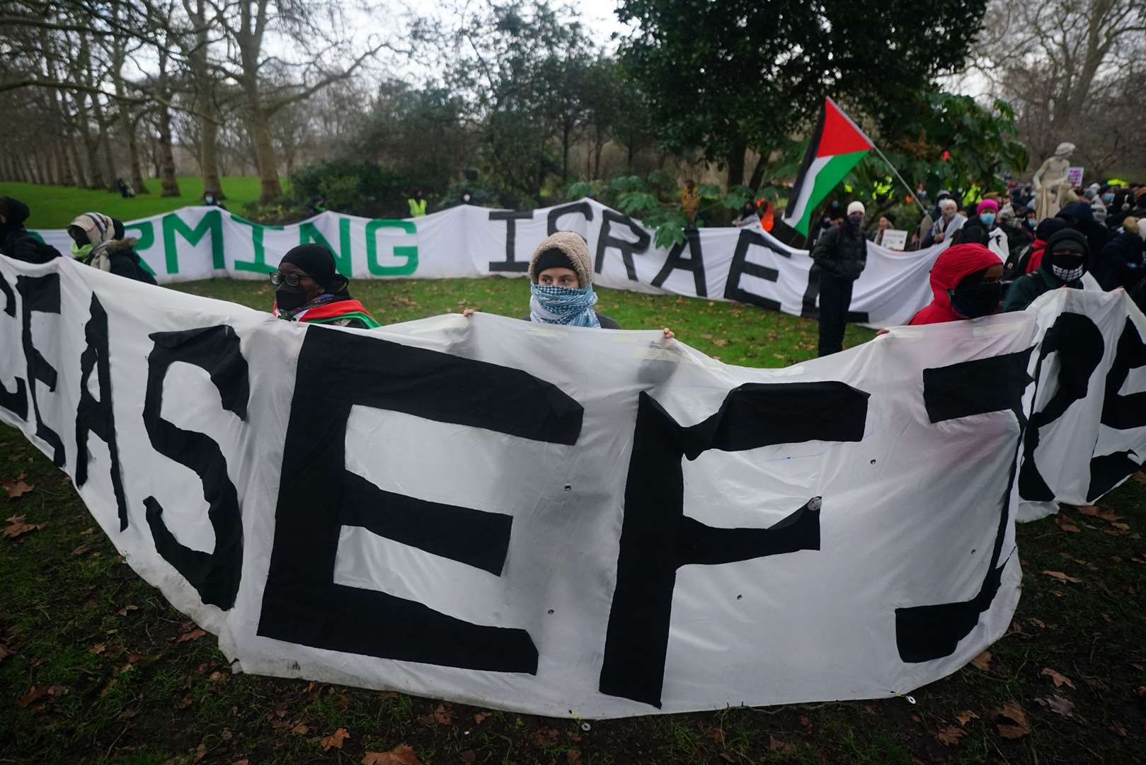 People gather in St James’s Park ahead of the Free Palestine Coalition demonstration (Victoria Jones/PA)