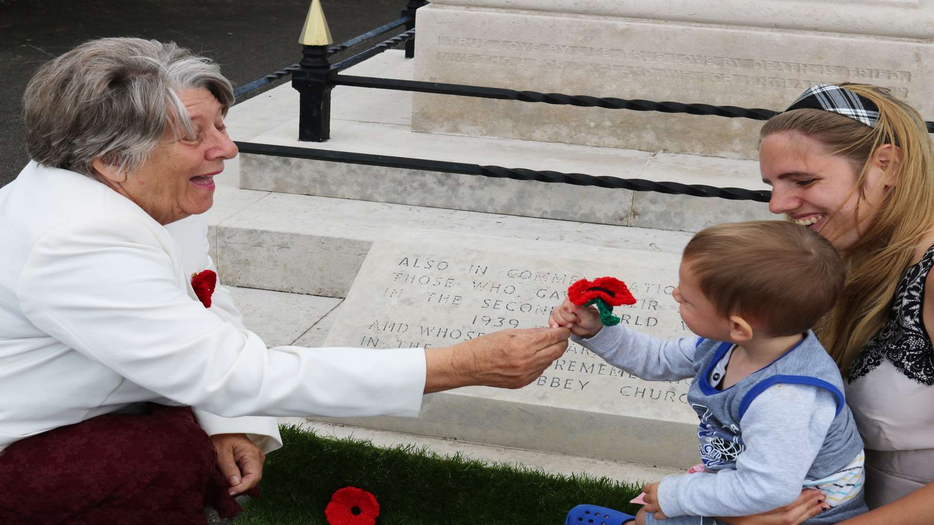 Cllr Sue Gent (left), vice chair of World War One Centenary steering group, with Bentley and Tanita Miller at the Sheerness war memorial.