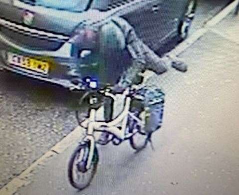 The hooded thief was spotted on CCTV with the bike
