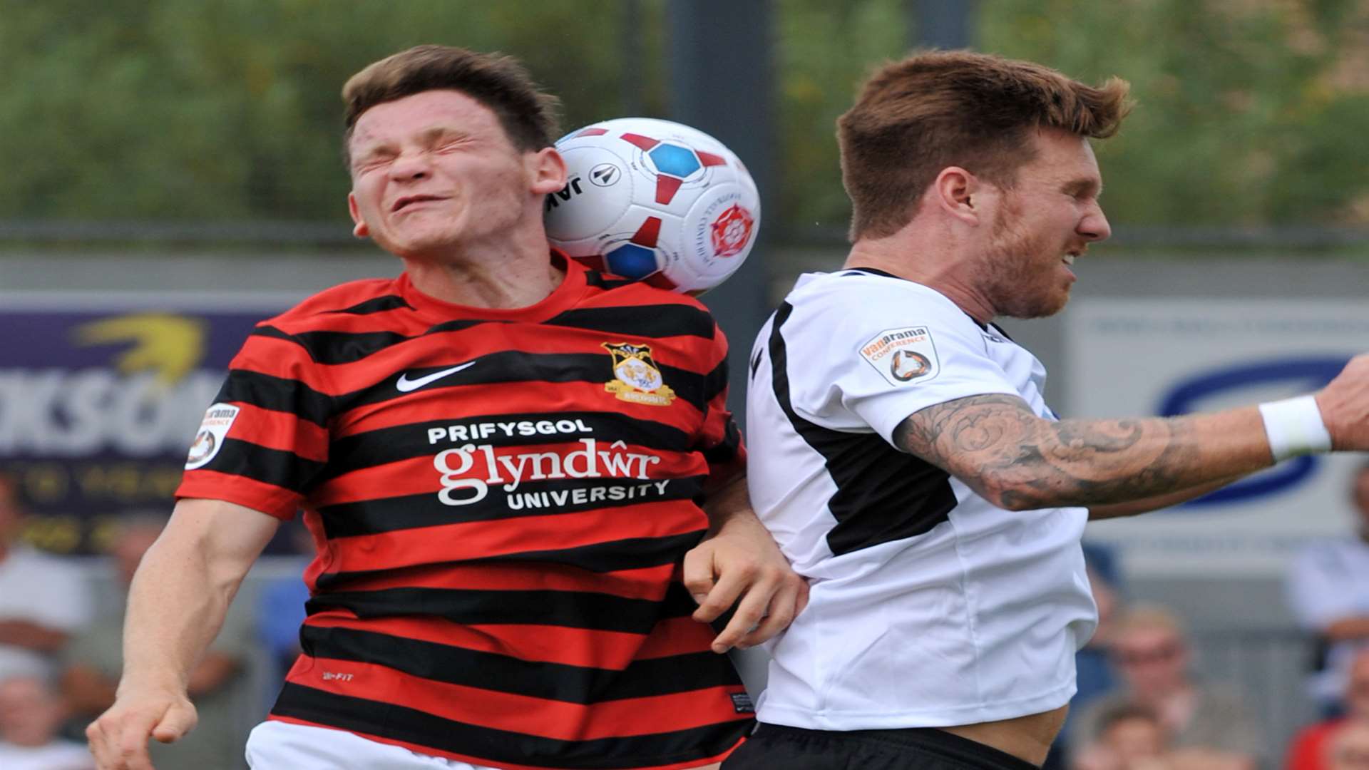 Elliot Bradbrook challenges Wrexham's Connor Jennings on the opening day of the season Picture: Richard Eaton