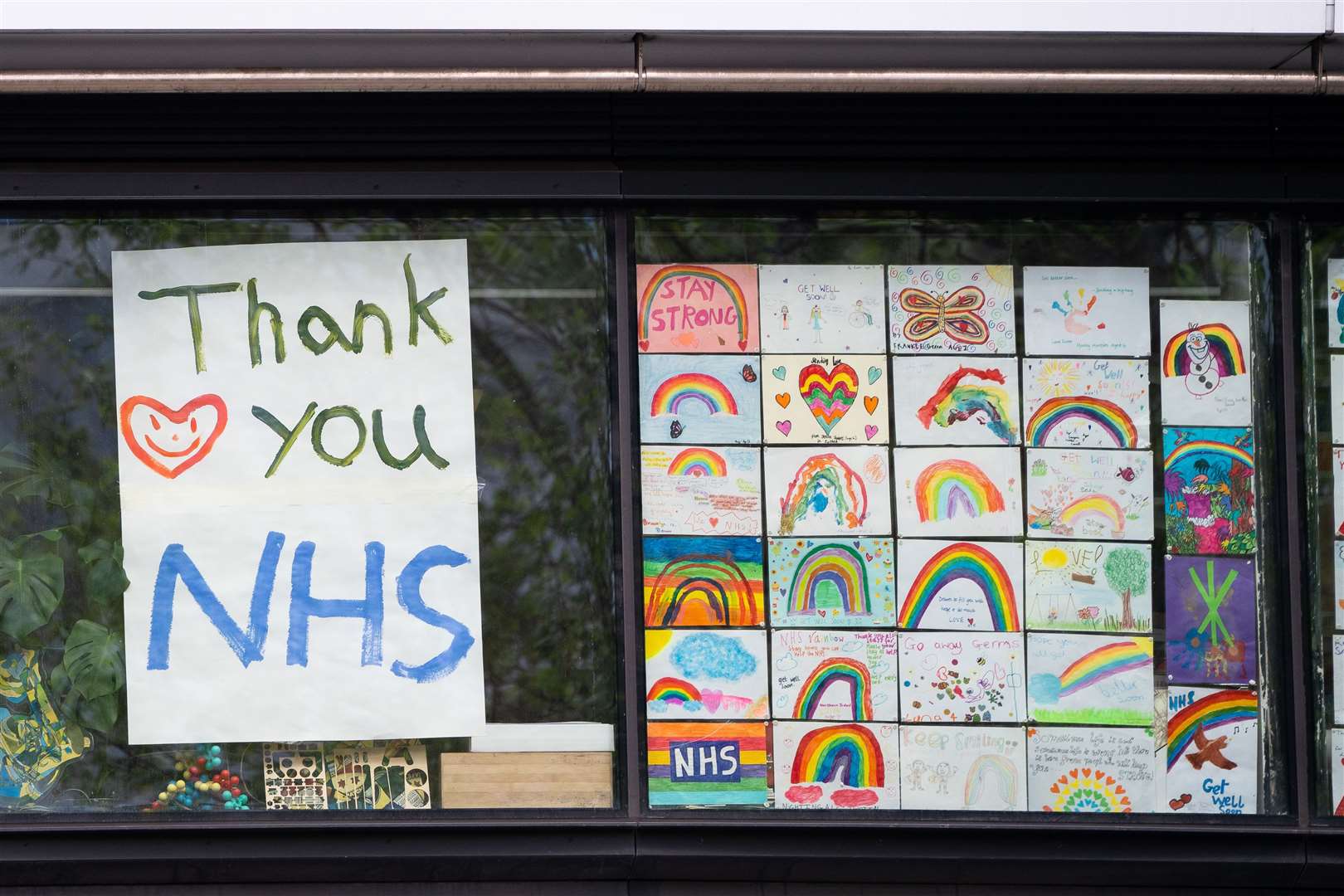 Rainbow drawings in the window of DLD College, London (Aaron Chown/PA)