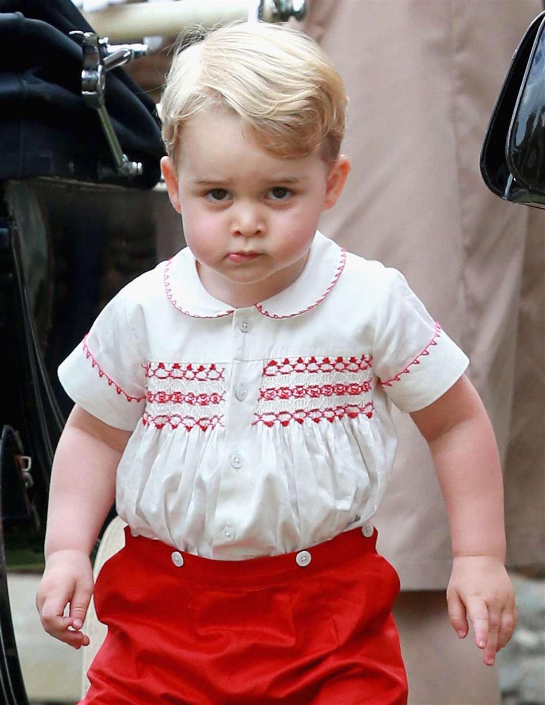 It was another solemn picture of George later in the year at his sister’s christening (Chris Jackson/PA)