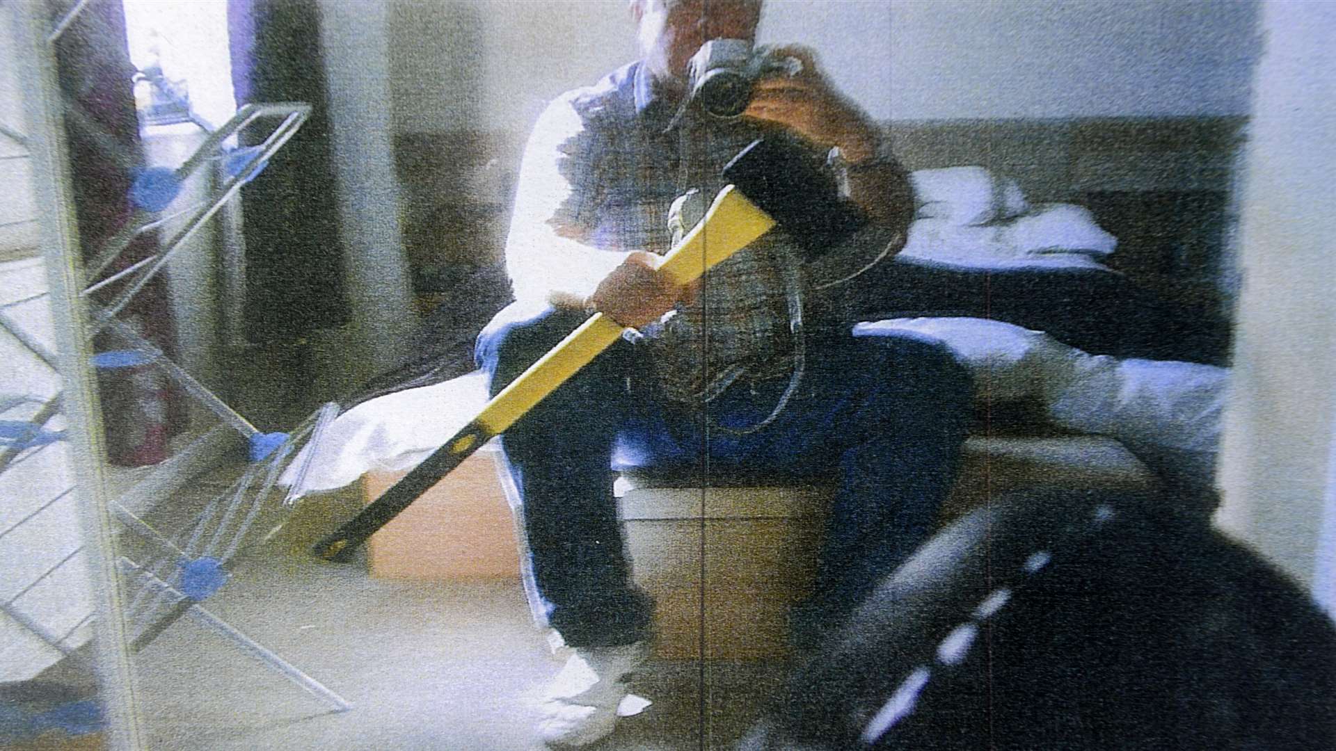 Bolinger poses with an axe - a picture which was shown to the jury during his 2014 trial