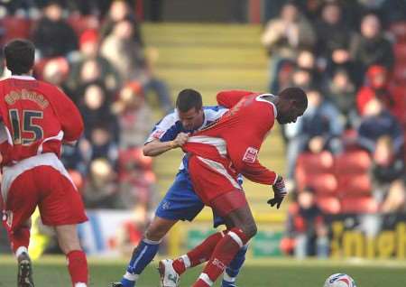 Bas Savage, then with Bristol City, in a tussle with former Gillingham man Chris Hope in a match in March this year. Picture: MATT READING
