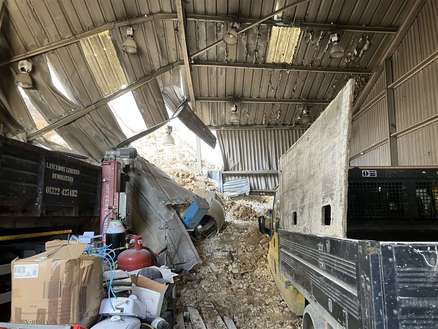 The cliff collapse sent tons of rubble into Lancebox's warehouse