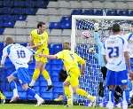 Simon Royce punches clear from a crowded box. Picture: Matthew Reading