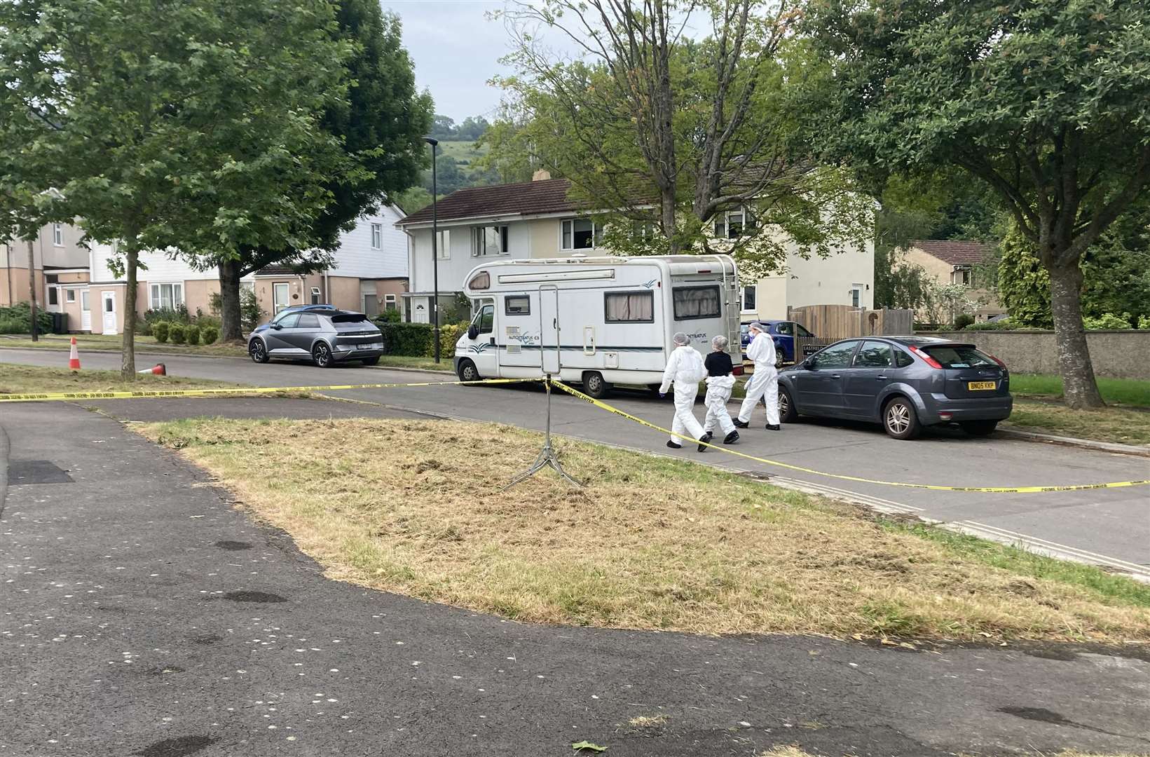 Forensics officers look for evidence near where the boy was fatally stabbed on Saturday evening (Jordan Reynolds/PA)