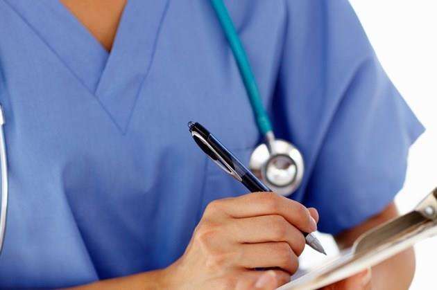 A nurse taking notes. Stock Image.