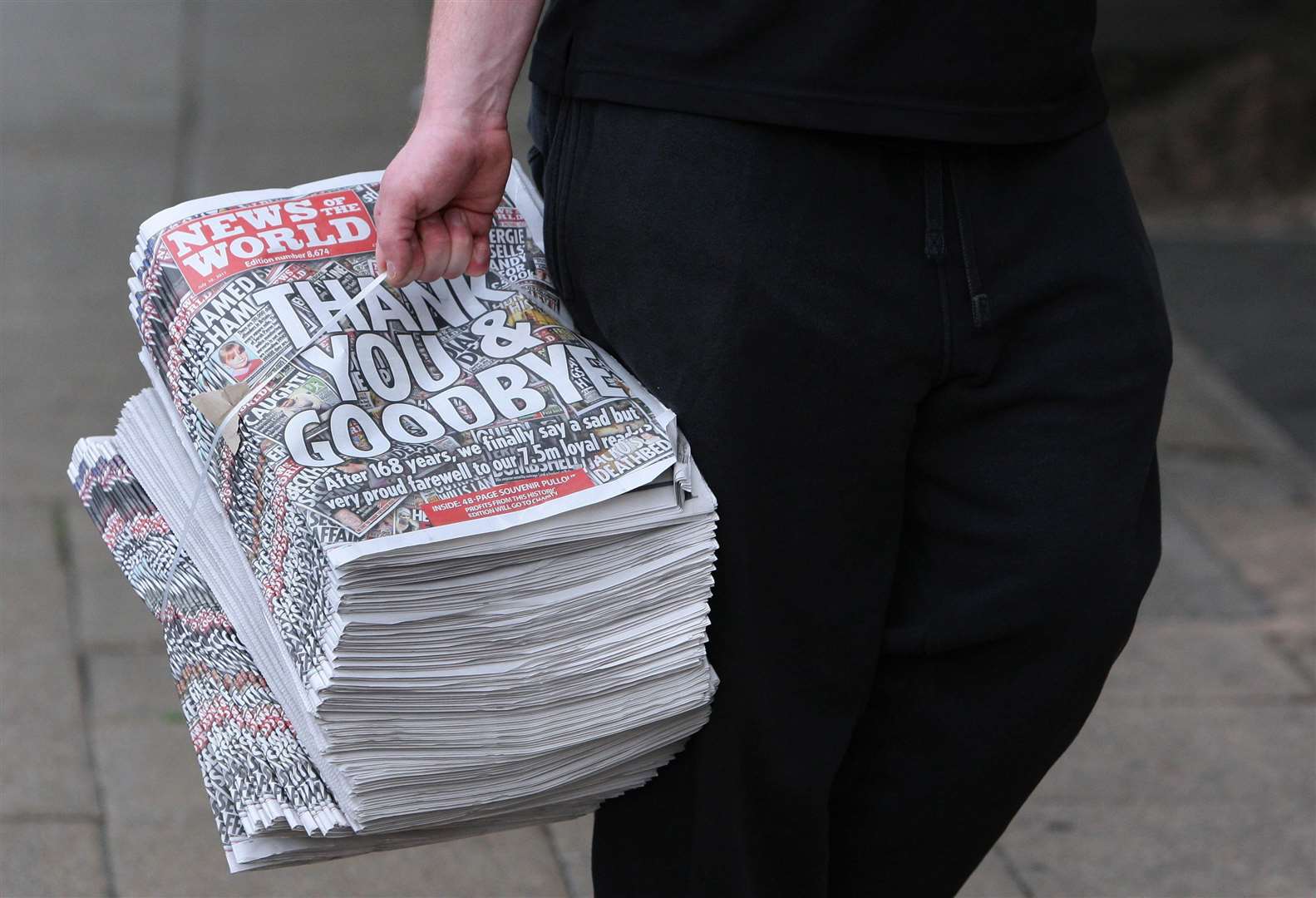 A bundle of the final copy of the News Of The World newspaper printed in July 2011 (PA)