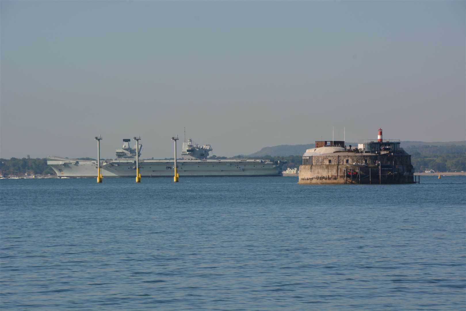 HMS Queen Elizabeth passes a Palmerston fort in the Solent (Ben Mitchell/PA)