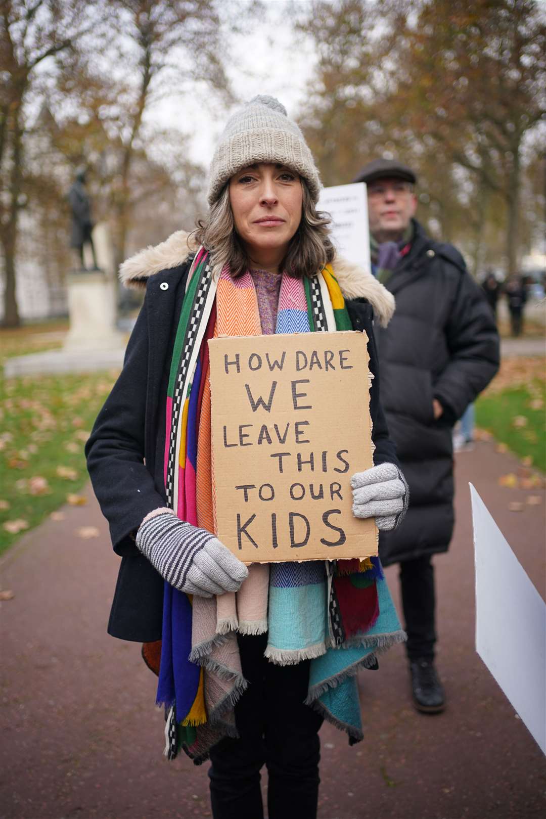 A protester outside New Scotland Yard (Yui Mok/PA)