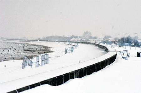 Snow covers the beach