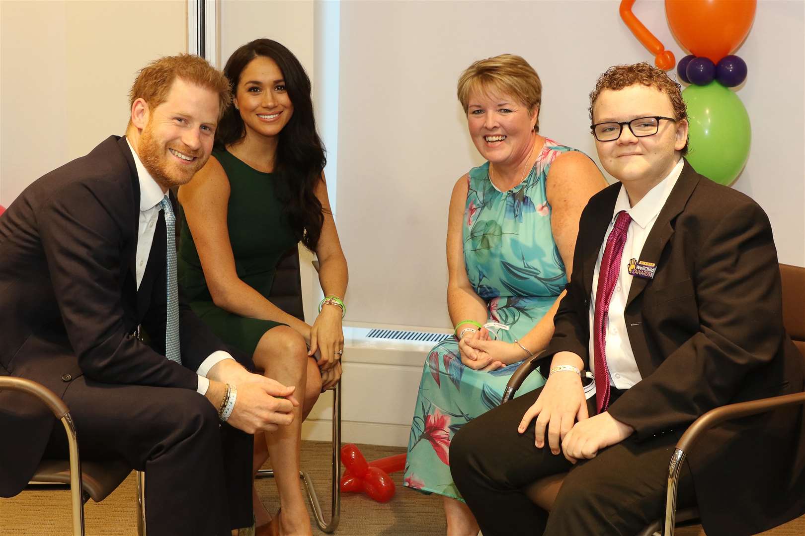 Oakley Orange, from Rochester, with his mum Lorraine chat to the Duke and Duchess of Sussex Prince Harry and Meghan Markleis presented with an award and meets Prince Harry during the WellChild Awards 2019 in London.