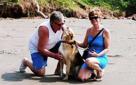 Together again - John and Teresa Dunne with Kimberley on the beach in Goa.