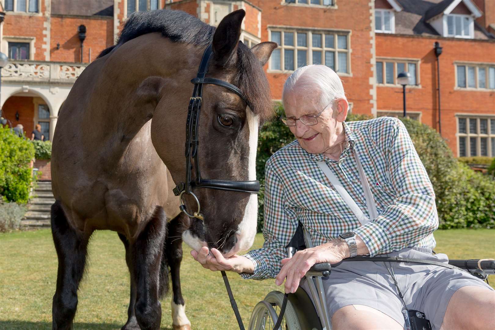 Mr Grace and Rosie the horse in the garden of Care UK’s Milner House (Andrew Williams/Care UK/PA)