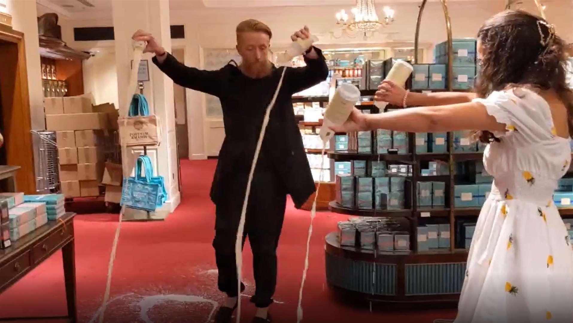 Supporters of Animal Rebellion pouring out milk in Fortnum & Mason in London (Animal Rebellion/PA)