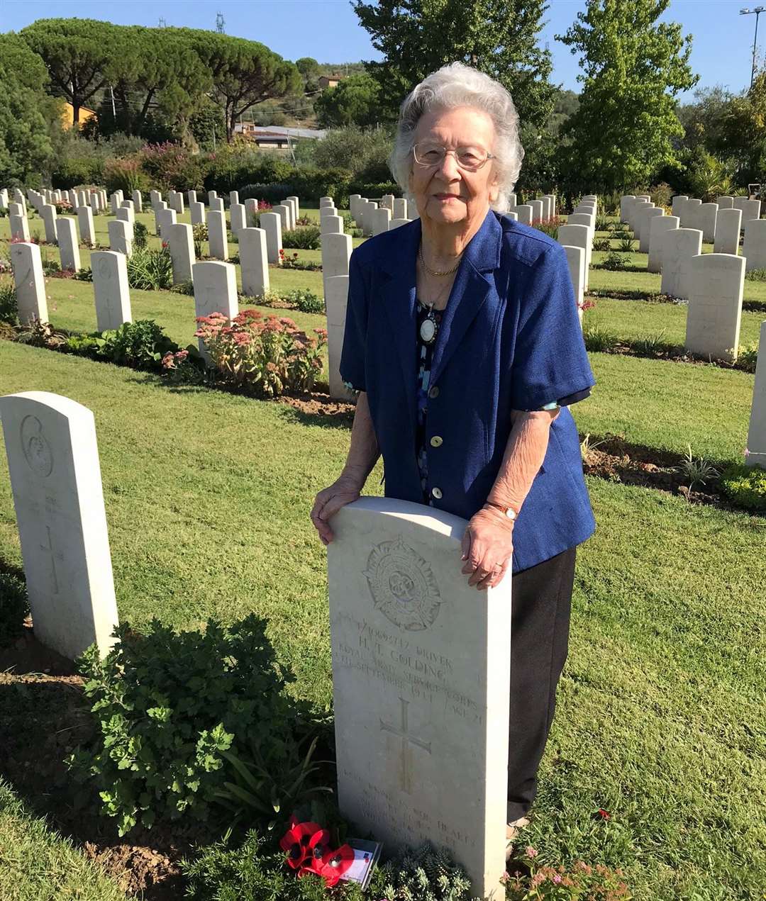 Bernice Bartlett at the grave of her first husband, Harry Golding, who was killed in action near Florence, Italy in 1944