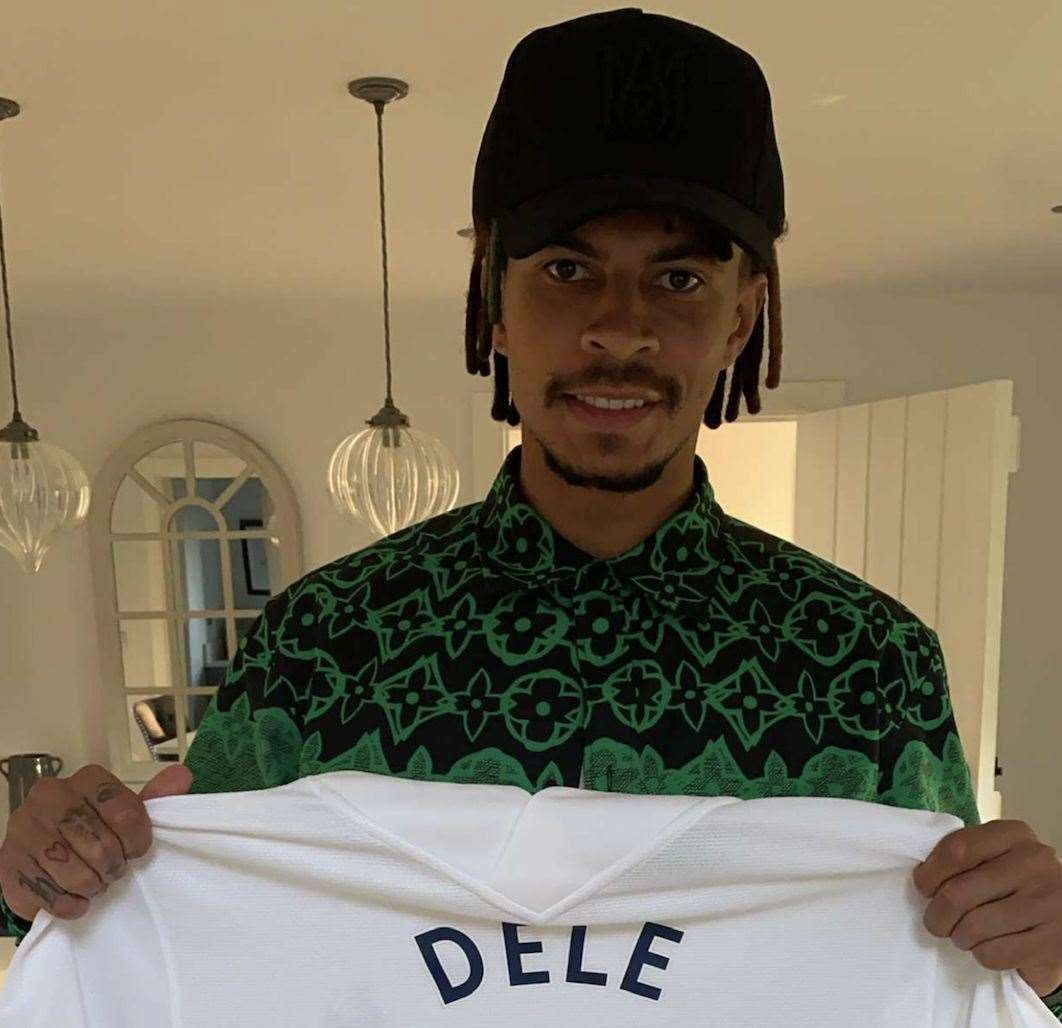 Dele Alli with a shirt gifted to Wing Kingz. Pic: Aaron Murrell